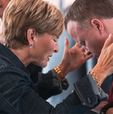 Two individuals engaging in a heartfelt moment.