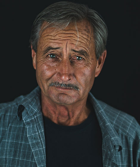 Elderly man with a thoughtful expression.