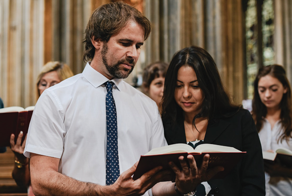 Couple reading in a religious setting.